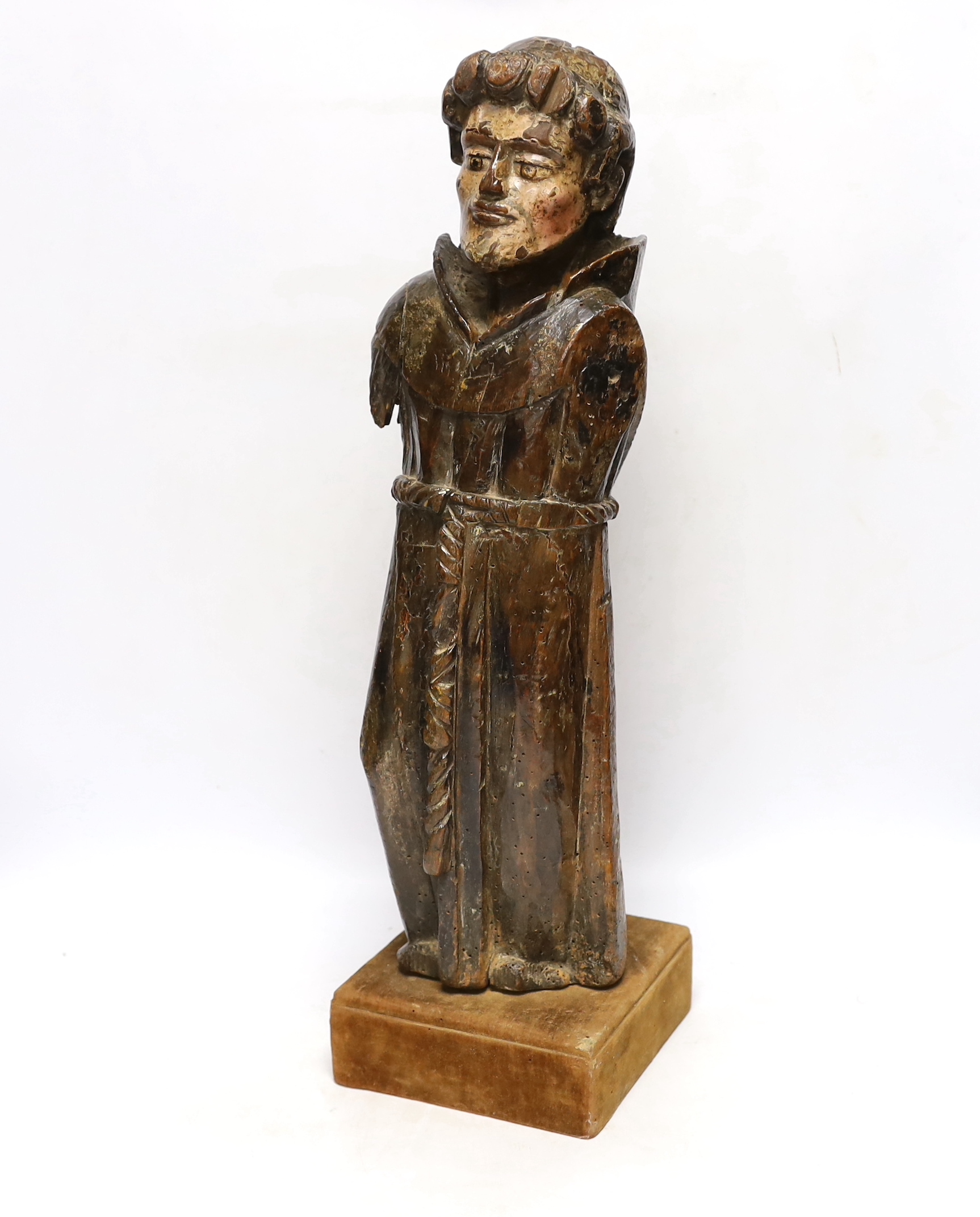 An oak carved monk with polychrome face, 54cm high